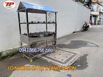 Lò nướng gà vịt nguyên con nướng bằng than chạy dây xích xoay đều xiên nướng tại quận 12 